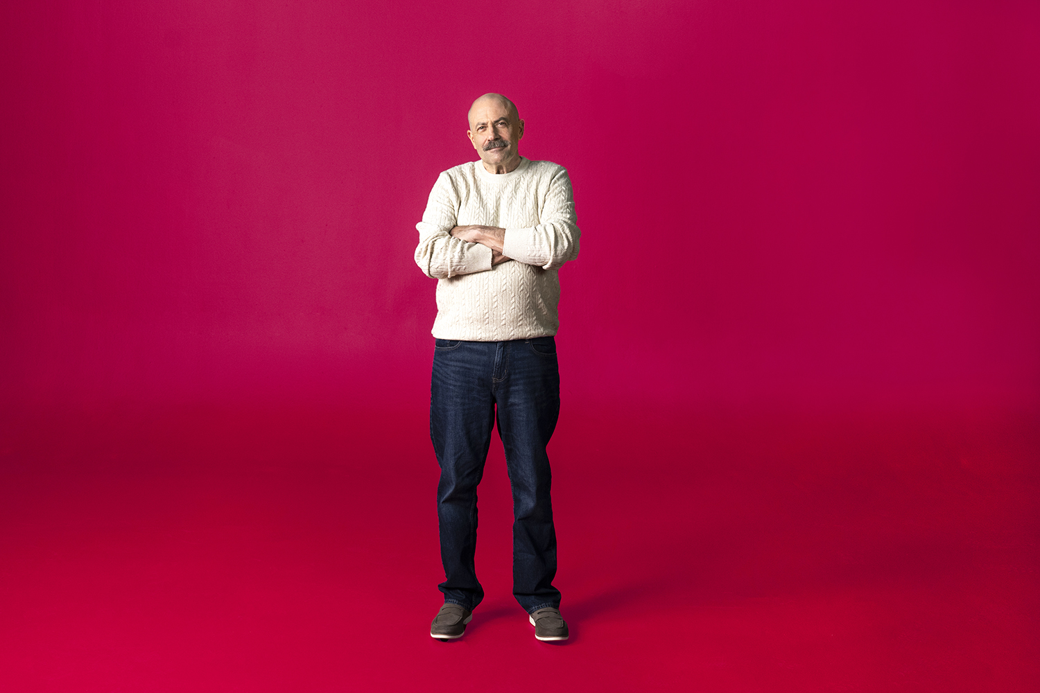 Scott standing with his arms folded